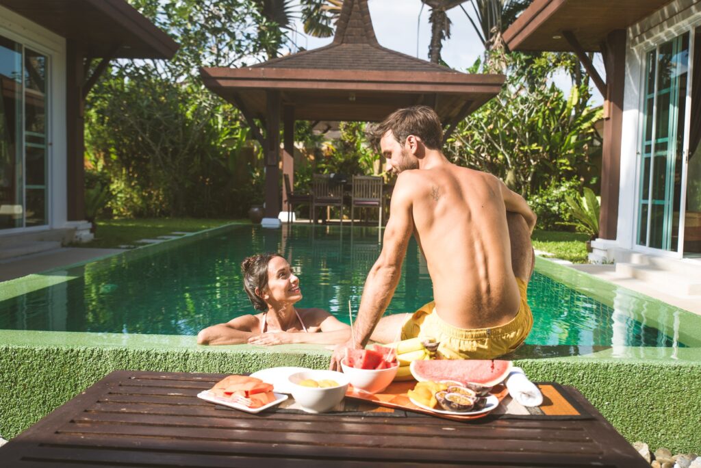 Couple of lovers in a beautiful villa with swimming pool
